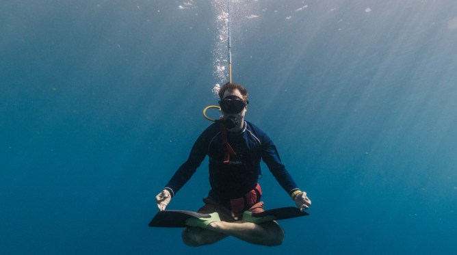 Diver in the water looking pretty zen