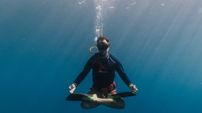 Diver in the water looking pretty zen