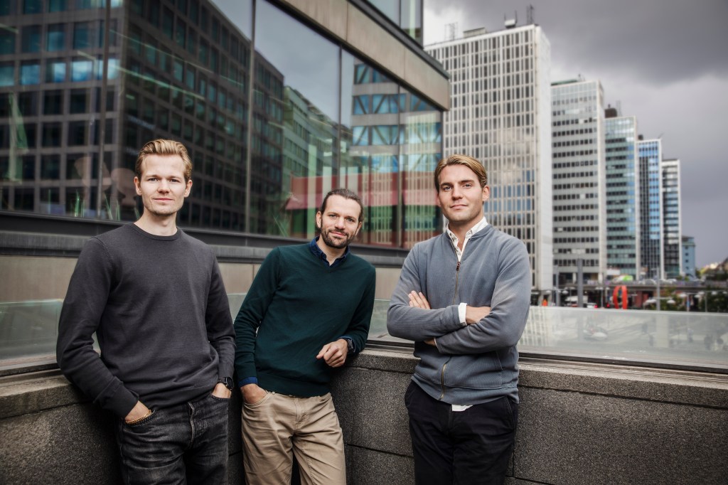 3 men on a balcony