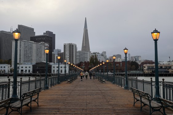 SAN FRANCISCO, UNITED STATES - NOVEMBER 6: People walk on Pier 7 as Transamerica Pyramid is seen during a cloudy weather in San Francisco, California, United States on November 6, 2022. (Photo by Tayfun Coskun/Anadolu Agency via Getty Images)