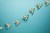 US Dollar Bill Paper Airplanes with Dotted Chalk Path Creative Idea on Blue Background