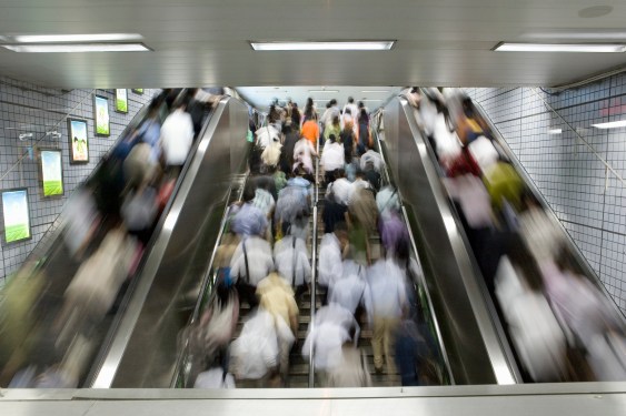photo of many people on an escalator