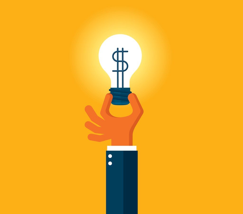 consultant, venture firms hand holding light bulb orange background