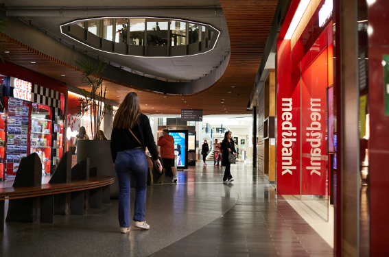 Medibank logo on side of store in a mall