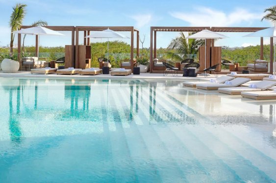 Cabanas beside a large pool