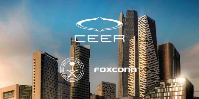 Skyscrapers in the backgrounds with the logos of Ceer, Saudi Arabia Public Investment Fund and Foxconn on it.