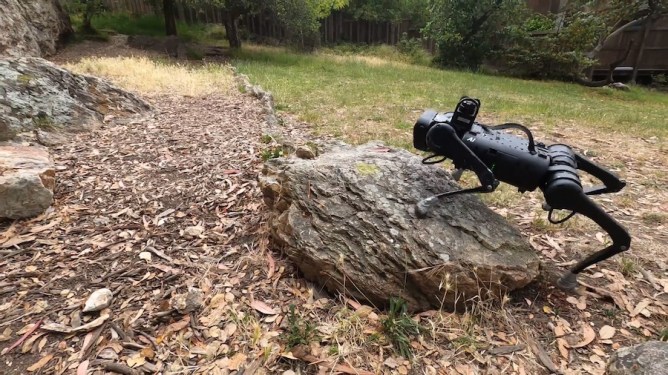 robotic dog traversing a boulder