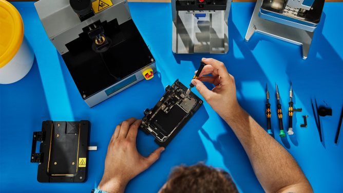 person doing self-repair on electronic devices