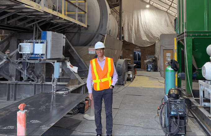 Dan Goldman at Carbon Upcycling's 20-ton reactor.