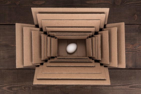 Egg Packed in Multi Layered Boxes on Wood Floor.