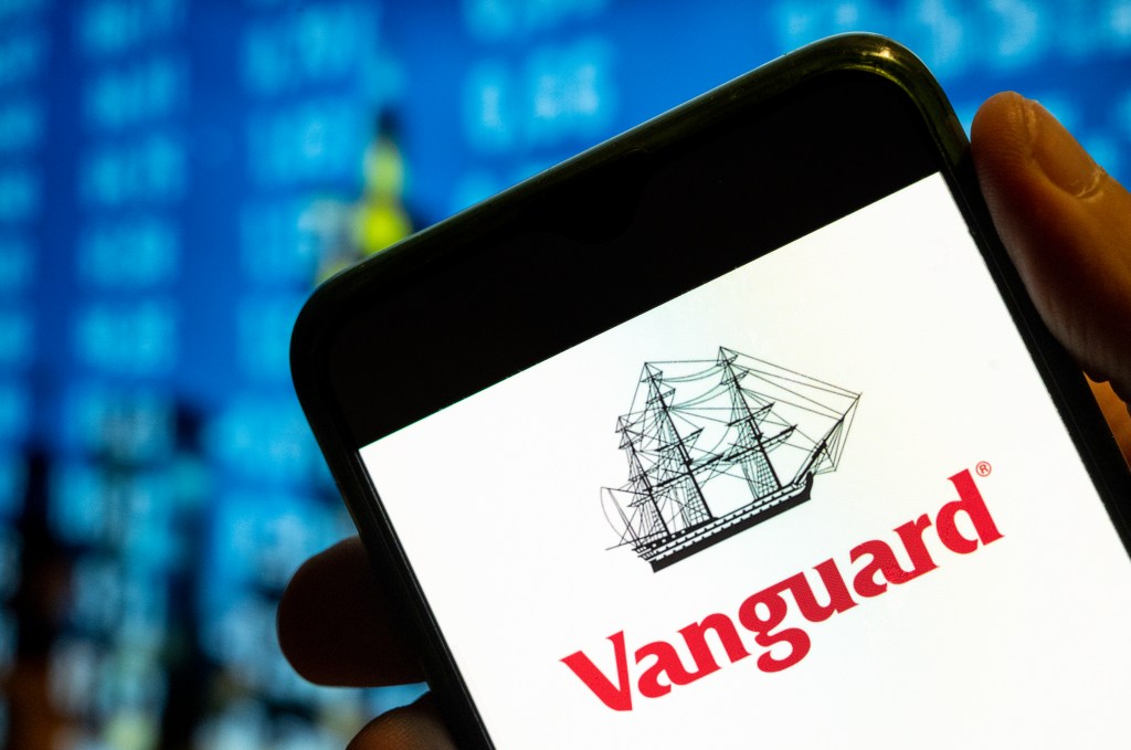 Vanguard Funds logo appears on a smartphone