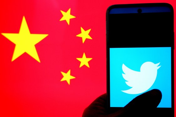 Twitter logo against Chinese flag