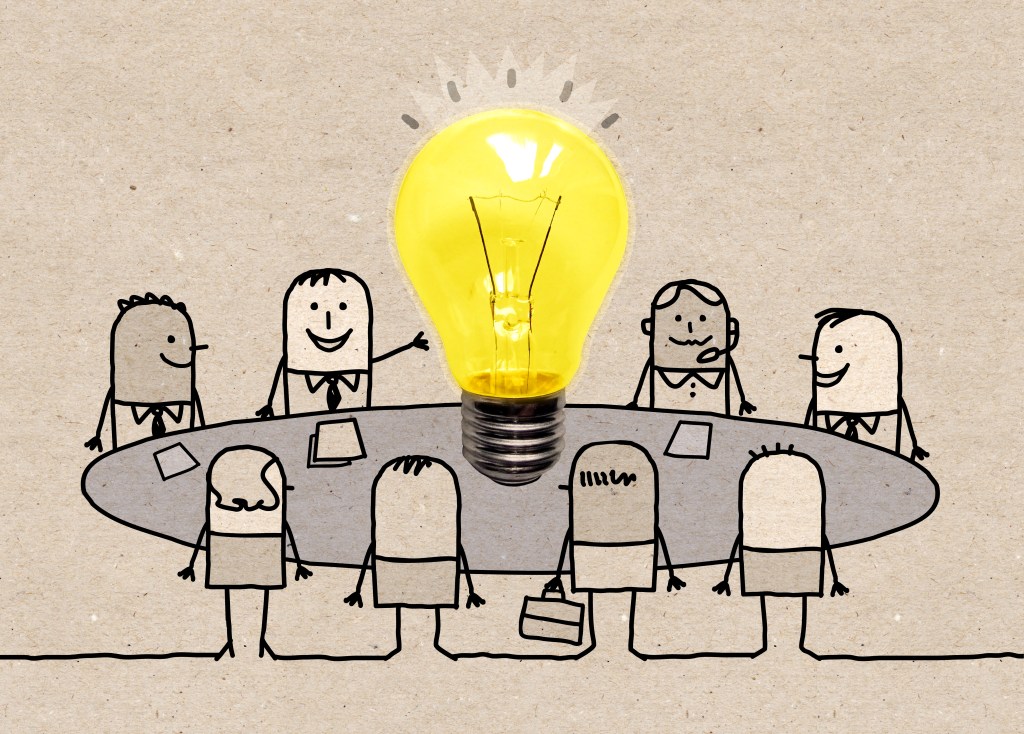 Hand-drawn cartoon of business people around a table with big light bulb.