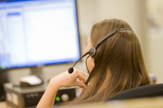 A photo of a call center representative taken from behind, used in a post about Operative Intelligence