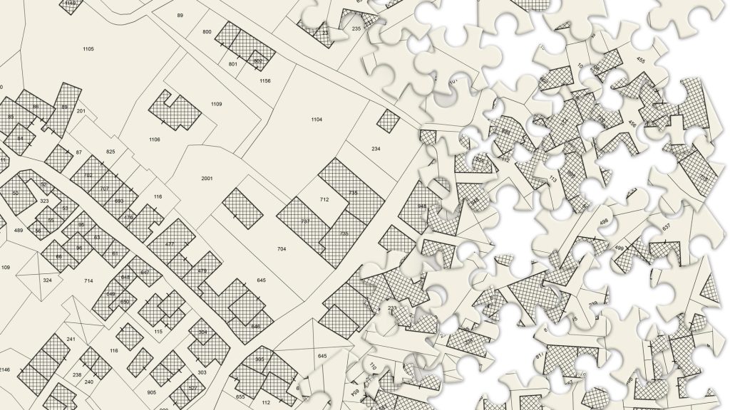 Imaginary cadastral map of territory with buildings and roads - concept image in jigsaw puzzle shape