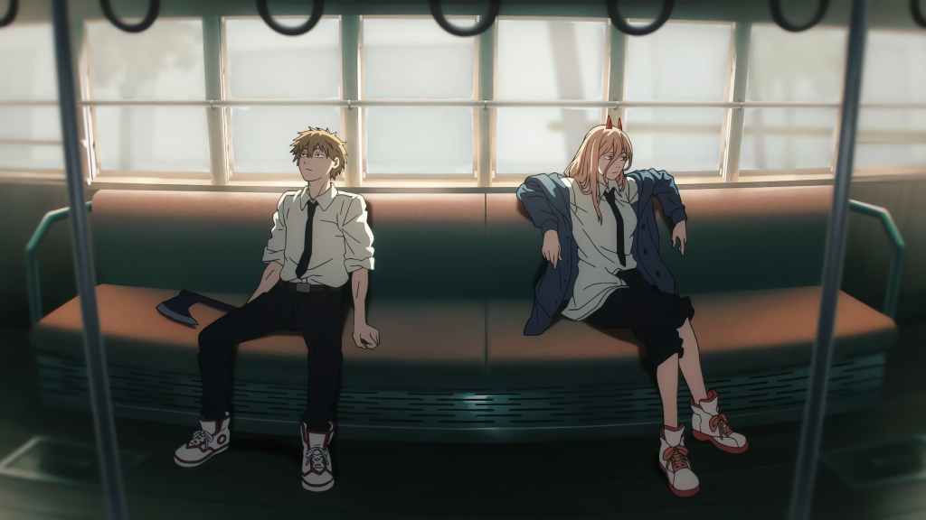 two anime characters sitting in a subway car