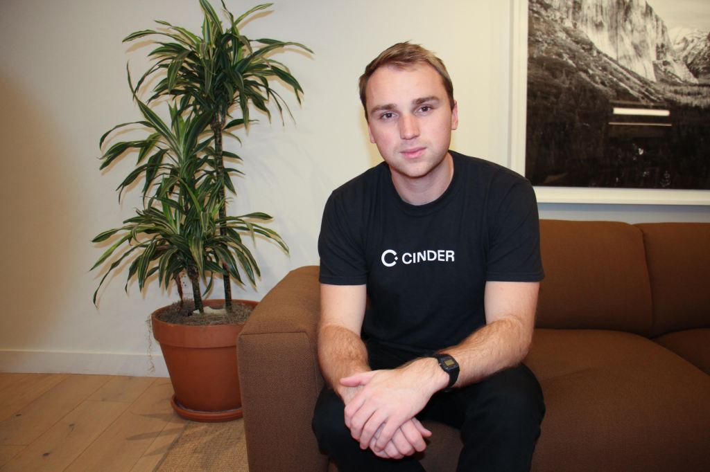 Glen Wise of Cinder, sitting on a couch