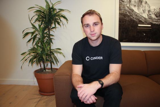Glen Wise of Cinder, sitting on a couch