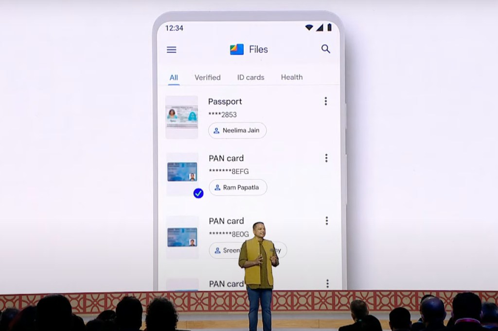 Ggoogle Files integrating DigiLocker displayed on a large screen behind a man talking onstage