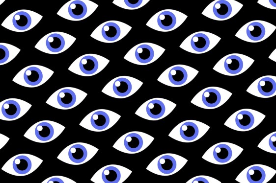Blue eyes on a black background titled at an angle