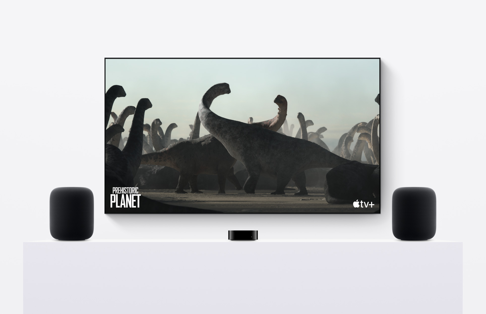 Apple TV+ in between two Apple HomePod 2 speakers
