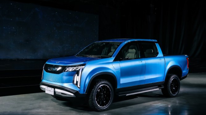 blue electric pickup truck with model v on license plate