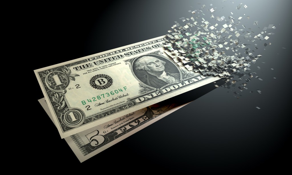 Dollar bills fading away on a black background.