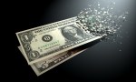 Dollar bills fading away on a black background.