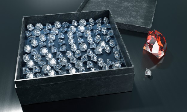 Diamonds in a box with ruby on table