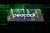 Peacock logo on a phone sitting on a keyboard