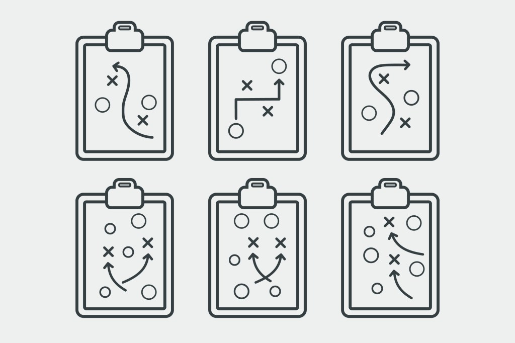 Image of sports plays on clipboards