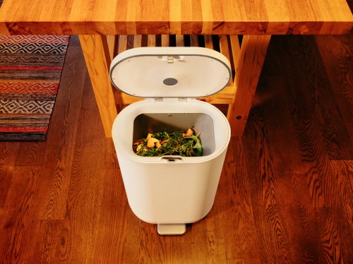Mill Industries' new food waste bin stands open in a kitchen.
