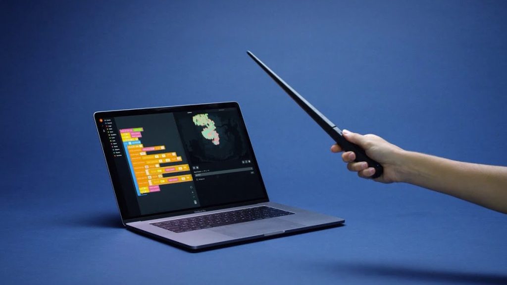 Kano's Harry Potter wand pointed at an open laptop