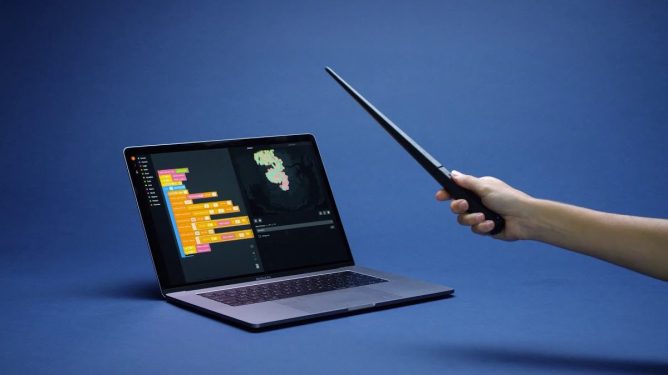 Kano's Harry Potter wand pointed at an open laptop