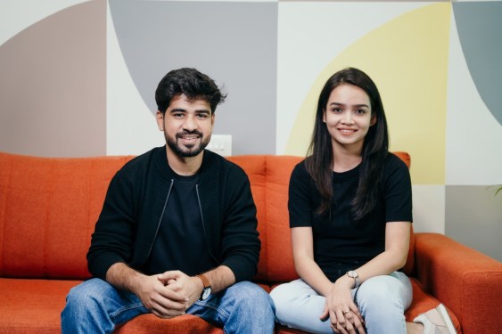 Peerlist founders seated on couch
