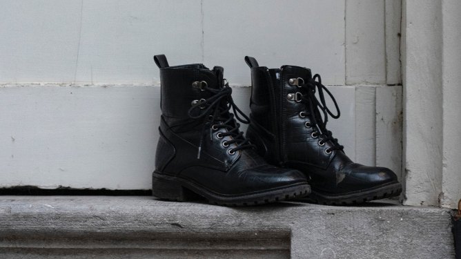 black boots with bootstraps