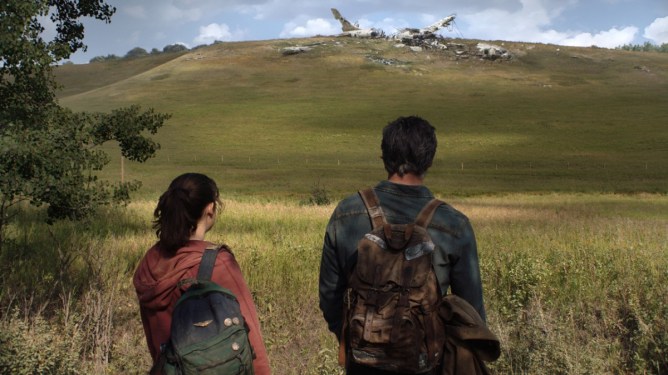 Scene from HBO's "The Last of Us" ... mand and woman staring at plane wreckage on distant hill