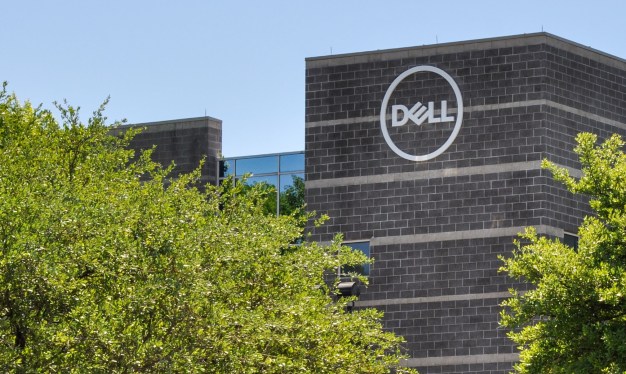 Exterior view of Dell headquarters with company logo on brick building.