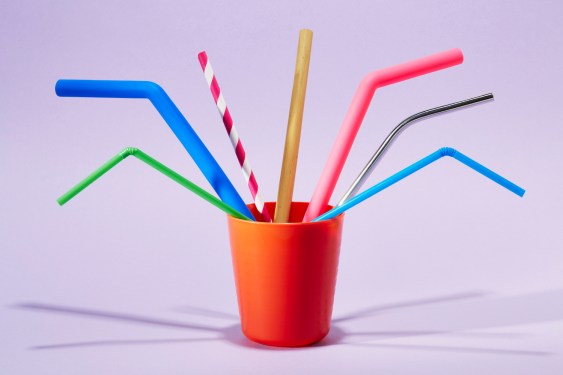 Seven different drinking straws in a cup