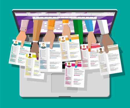 Hands coming out of computer screen holding resumes.