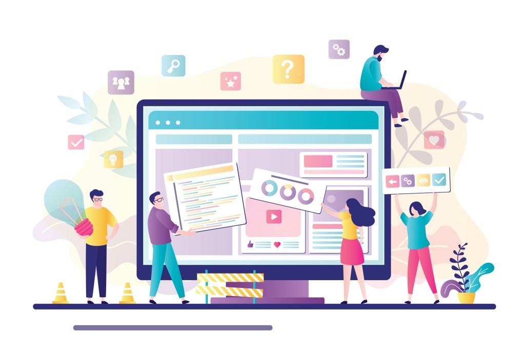 Business people collaborating to build a website.