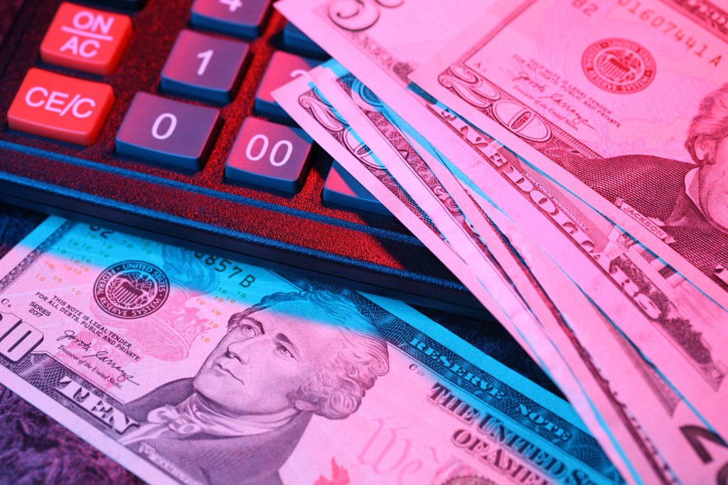 U.S. paper money lying on a calculator.