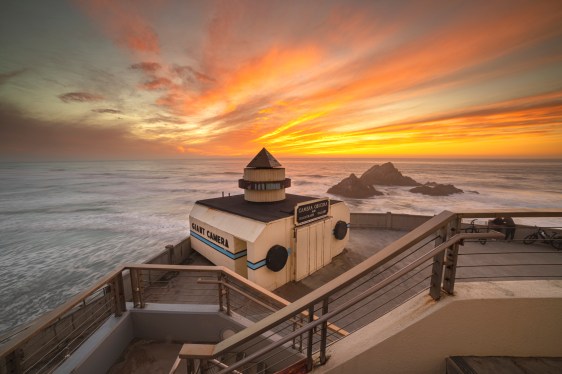 Ocean beach sunset by the Giant Camera behind Cliff House