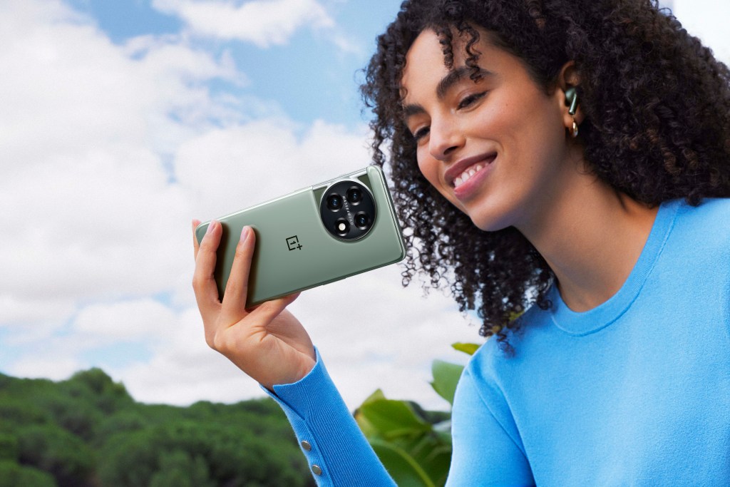 Woman holding OnePlus smartphone
