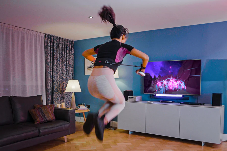 woman using Quell Impact Fitness in her living room