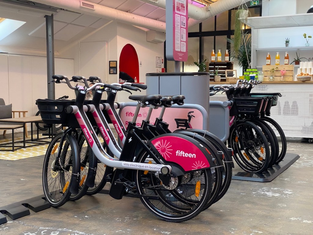 row of docked e-bikes