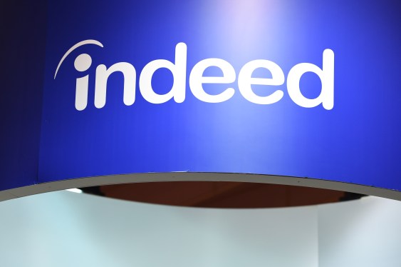 A logo above the Indeed booth on day two of the Web Summit in Lisbon, Portugal, on Thursday, Nov. 3, 2022. The Web Summit runs from 1-4 November. Photographer: Zed Jameson/Bloomberg via Getty Images