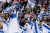 Protestors wave flags as thousands of Israelis attend a rally against Israeli Government's judicial overhaul plan on March 27, 2023
