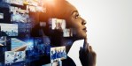 Woman thinking creatively and pictures appear behind her representing her creative process.