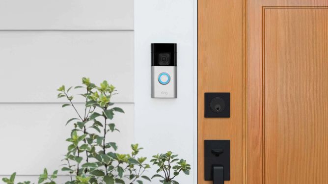 Ring doorbell installed on house next to front door